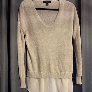 Cute sparkly off-white, silvery sweater.